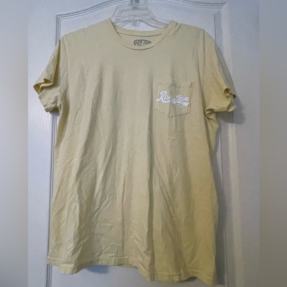 Ron Jon tee with colorful logo on back and front pocket